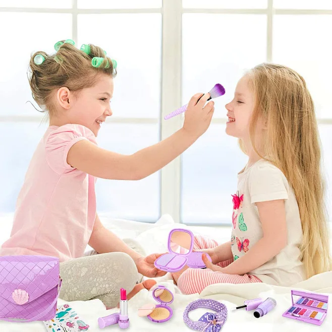 Little girl applying kids cosmetics safe for sensitive skin, allergy-free